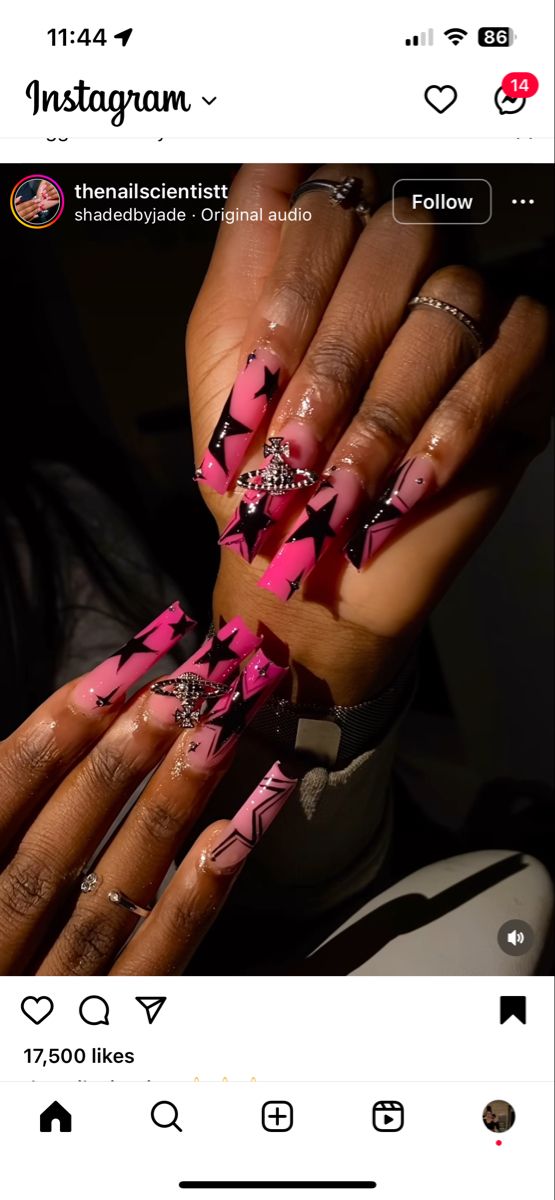 Edgy Pink and Black Nail Design with Geometric Shapes and Star Patterns.