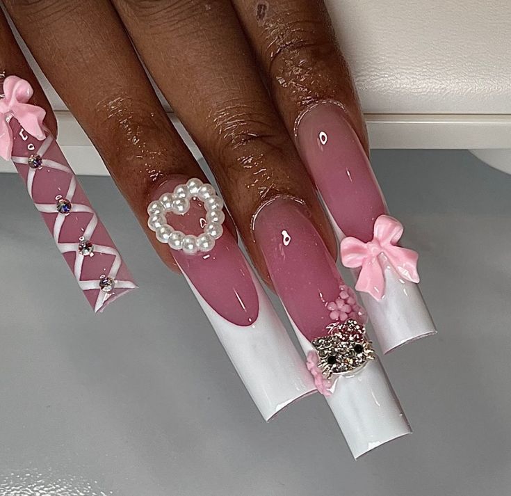 Whimsical Sophistication: Elegant Nail Design in Soft Pink and White with Glamorous Embellishments