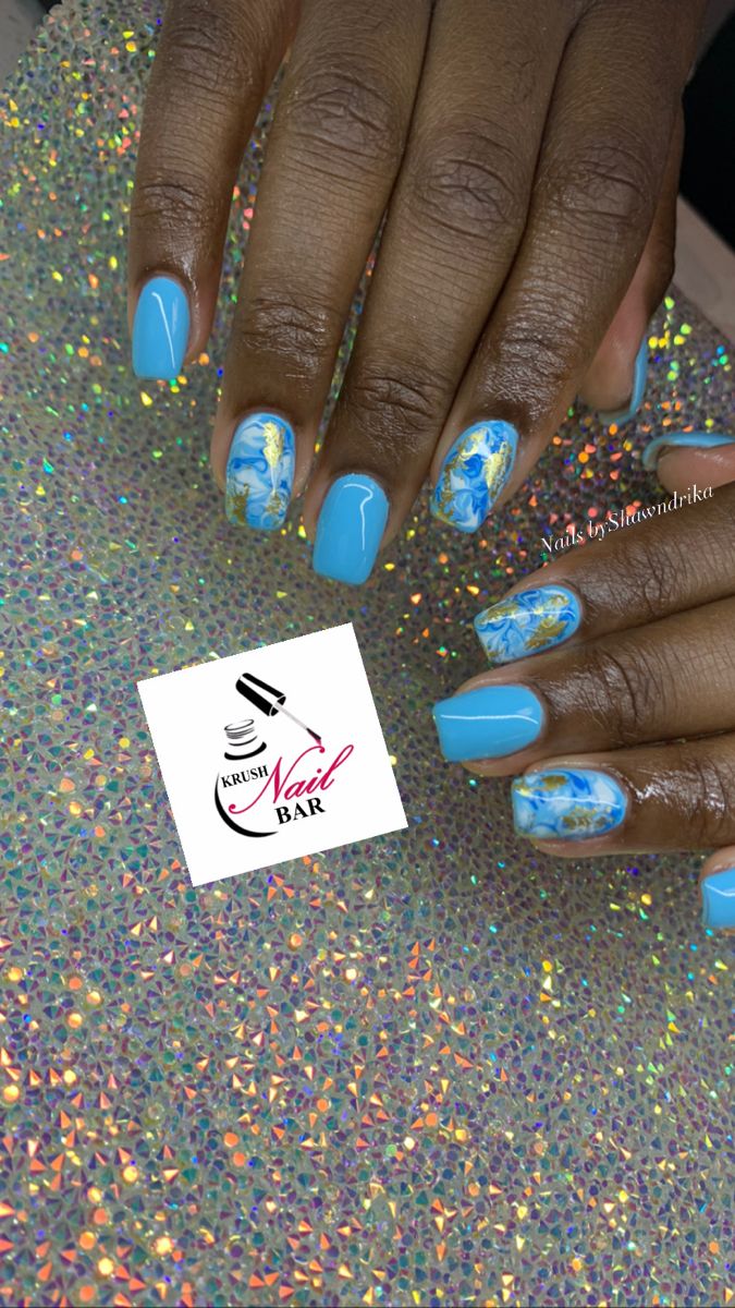 Chic Light Blue Floral Nail Design with Glossy Finish.