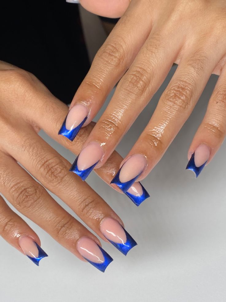 Elegant Modern French Tip Nail Design with Nude and Vibrant Blue Contrast.