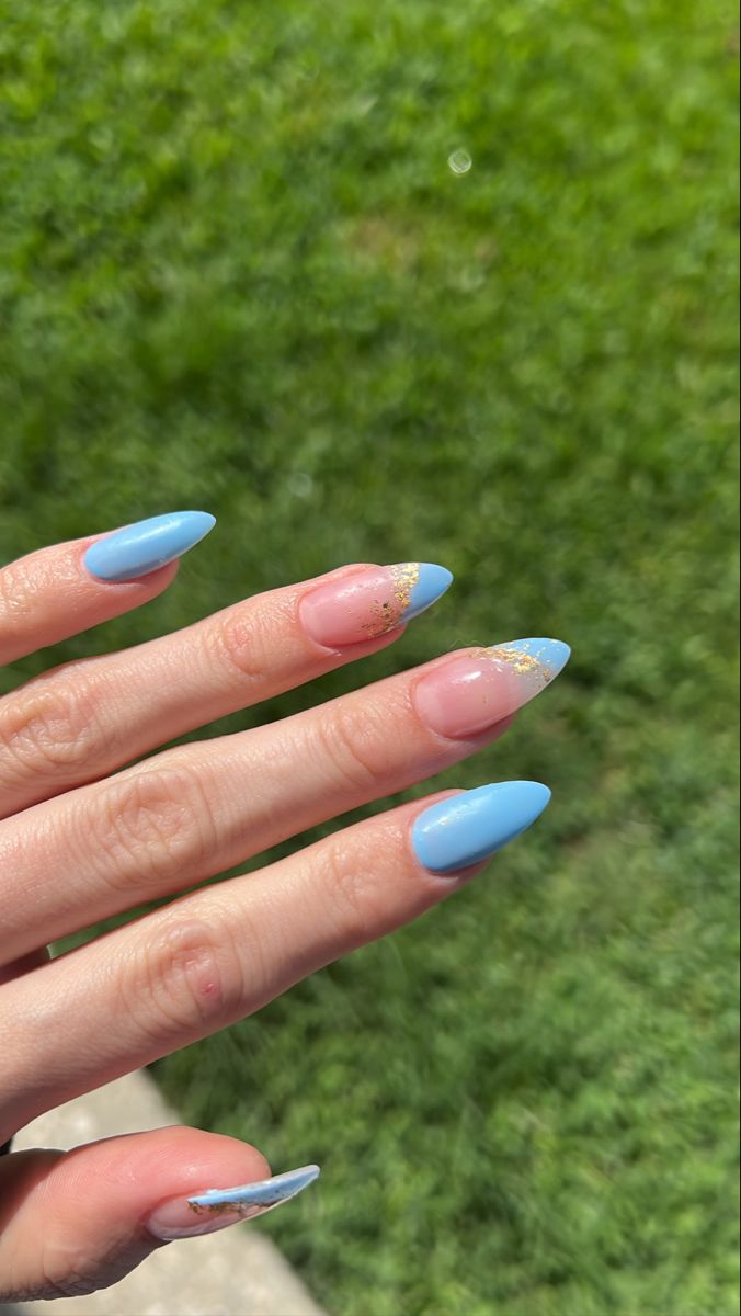 Chic Almond-Shaped Nails: Soft Blue with Pink Accents and Gold Glitter Tips