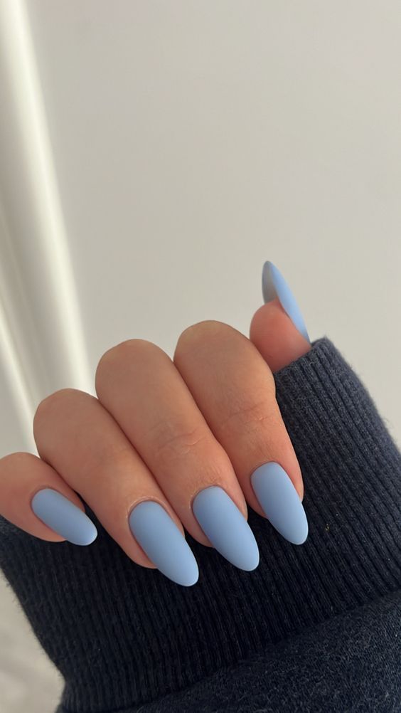Trendy Almond-Shaped Matte Blue Nails: A Chic and Calming Seasonal Look.