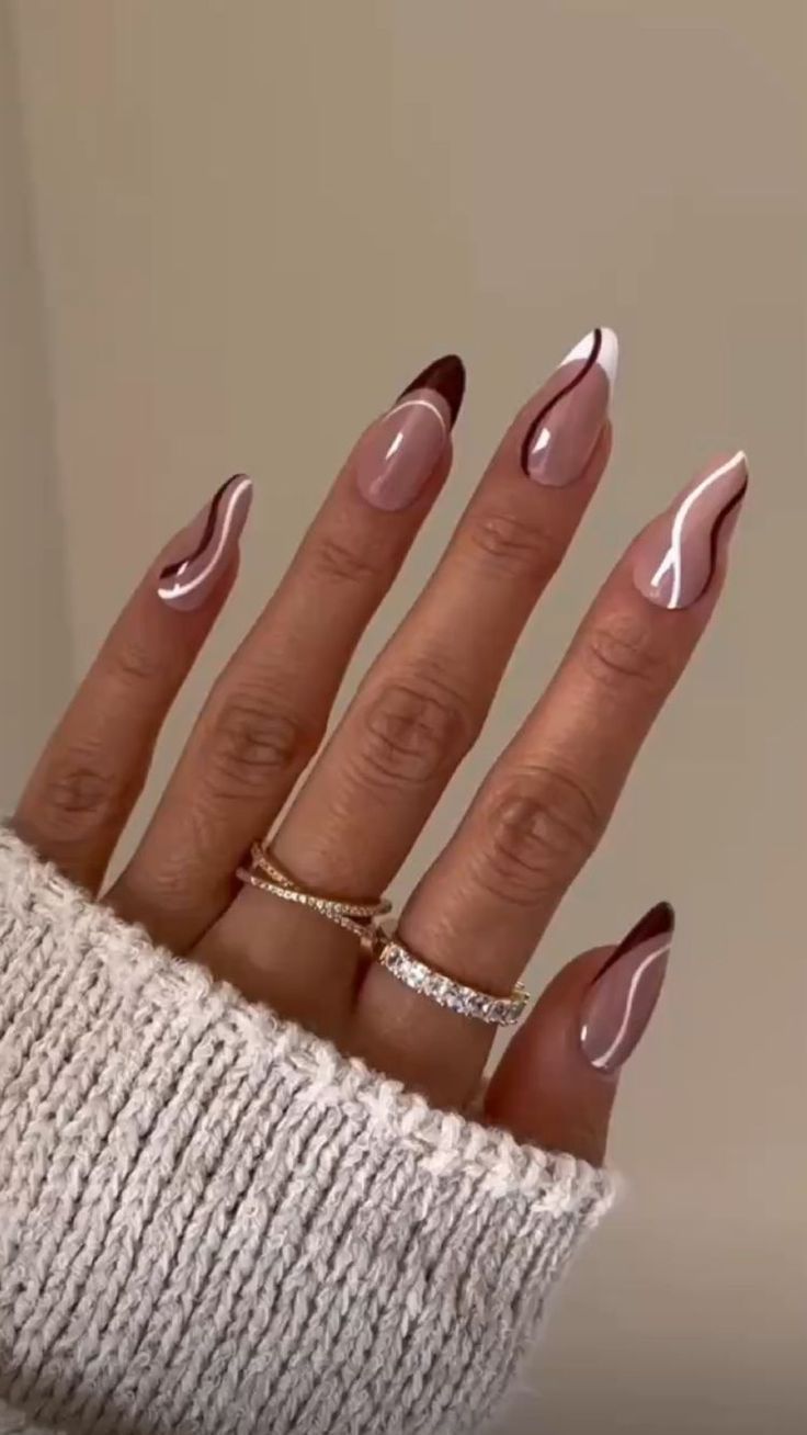 Chic Almond-Shaped Nail Design: Soft Nude with Dark and Light Accents