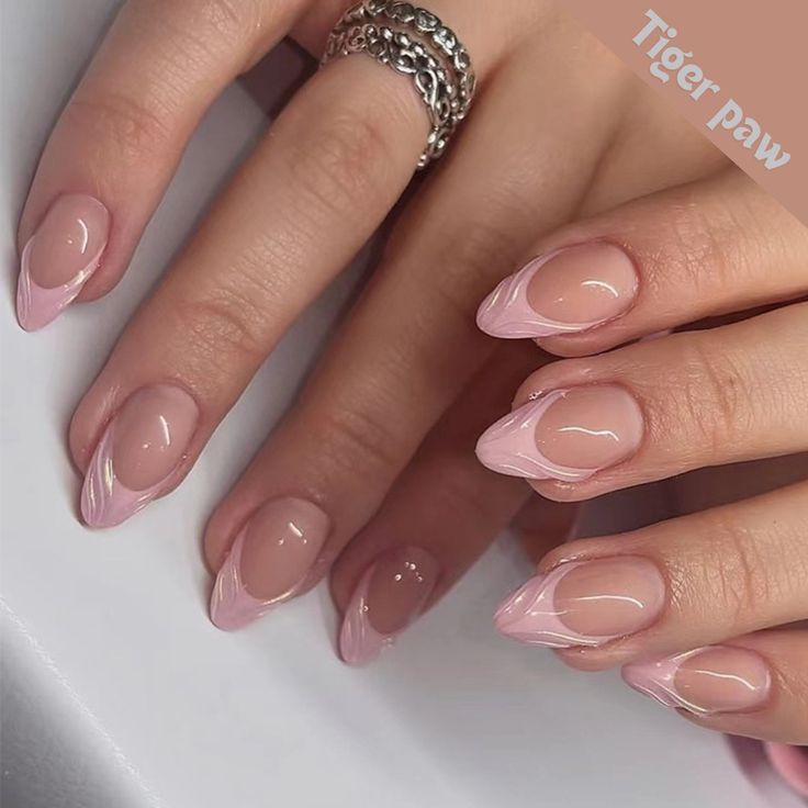 Chic Elegant Nail Design: Soft Pink with Unique Abstract Swirls and Transparent Tips.