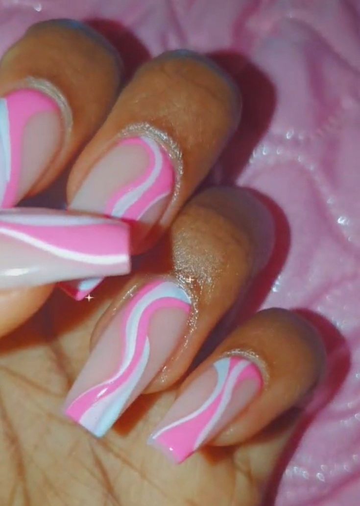 Elegant Swirl Pattern Nail Design in Soft Pink and White with Glossy Finish.