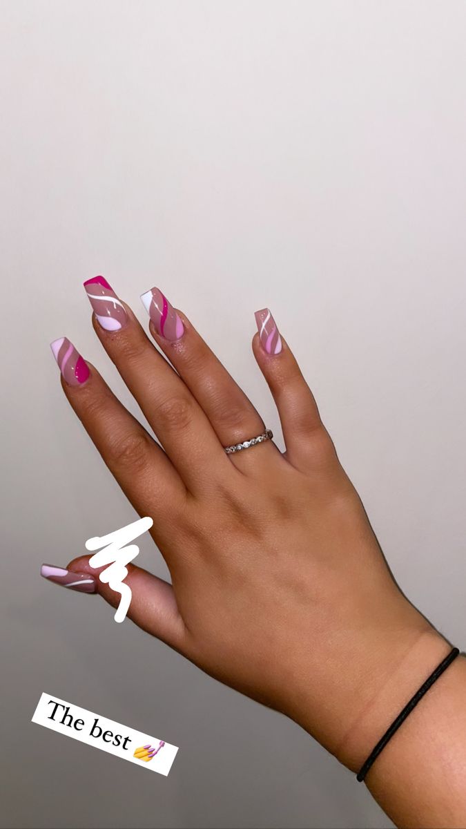 Modern Pink and White Nail Design with Artistic Patterns and Elegant Shine.