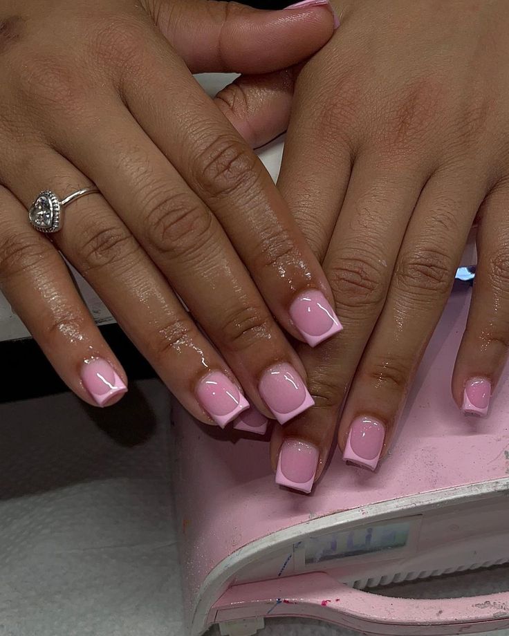 Chic Soft Pink Square Nail Design with Light Pink Tips and Silver Ring Accents.