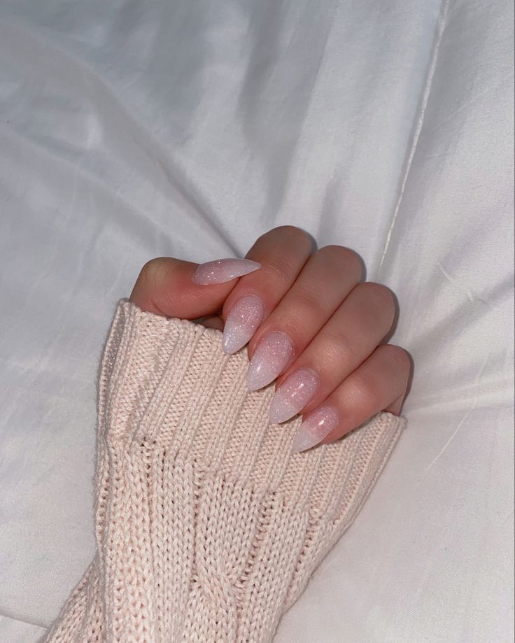 Chic Almond-Shaped Ombre Nails: Timeless Elegance Paired with Cozy Knit Fashion.