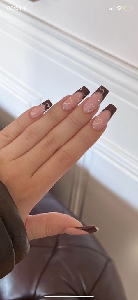 Chic Nude and Deep Brown Coffin Nails with Playful Heart Accents.