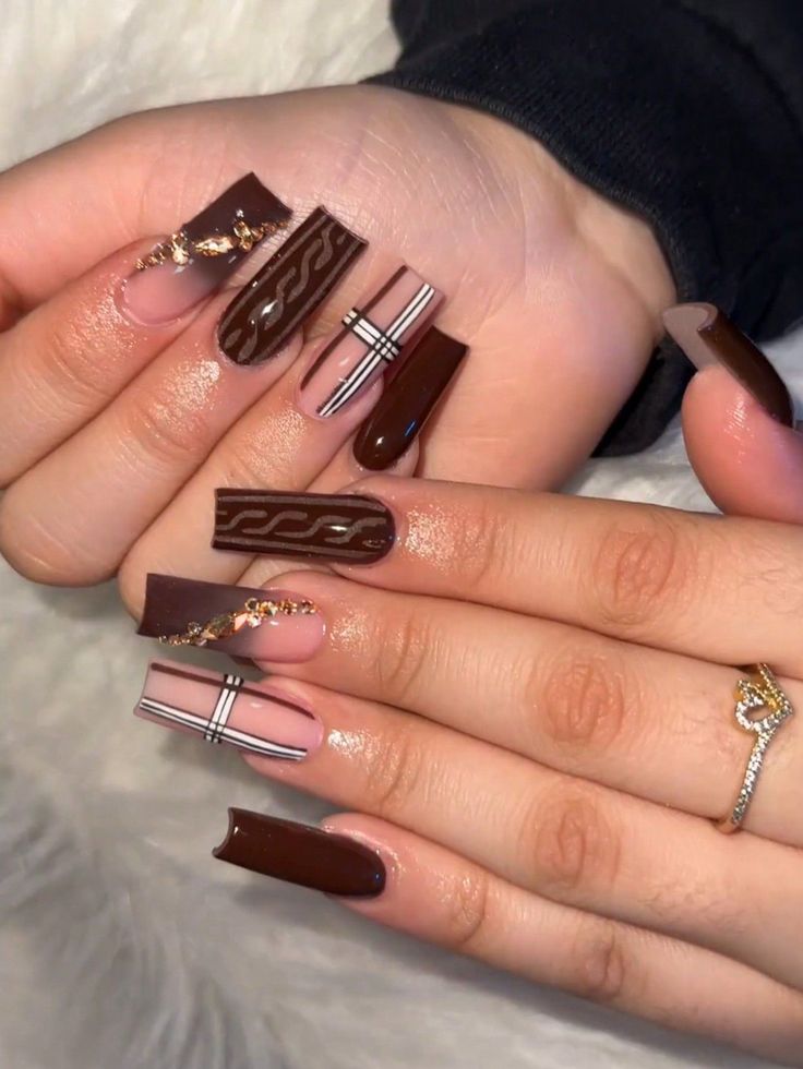 Elegant Brown Nail Design with Glossy and Matte Finishes, Artistic Detailing, and Rich Harmonious Shades.