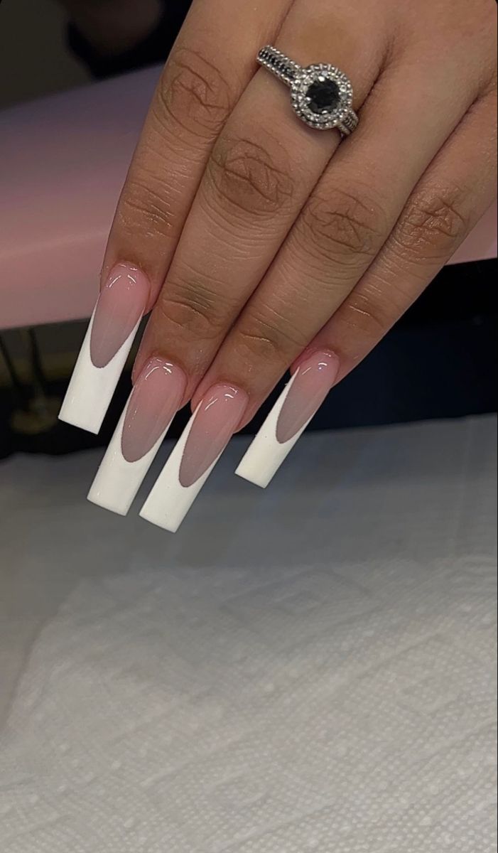 Elegant Gradient Long Nails: Soft Pink to Bold White Tips with Ombre Effect.