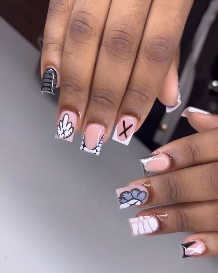 Chic Nail Design: Playful Patterns Meet Minimalist Aesthetics in Bold Black and White with Pastel Pink Accents.