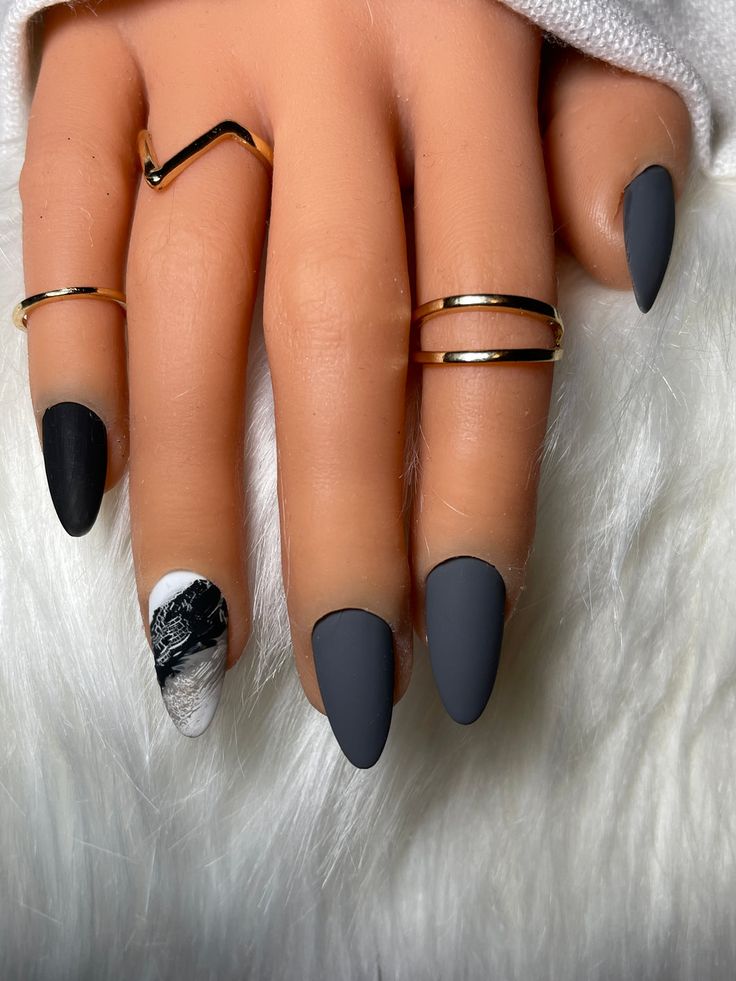 Elegant Matte Nail Design with Dark Gray and Black Colors Enhanced by Intricate Marbling and Chic Gold Accents.