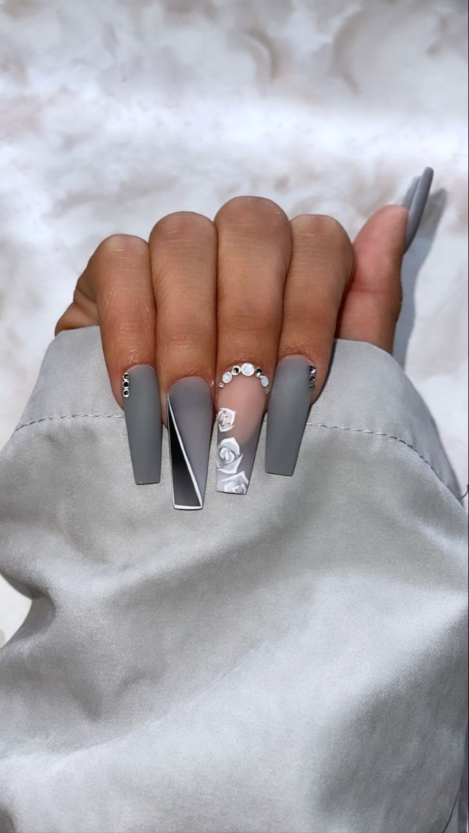 Sophisticated Matte Gray Nail Design with Geometric and Floral Accents