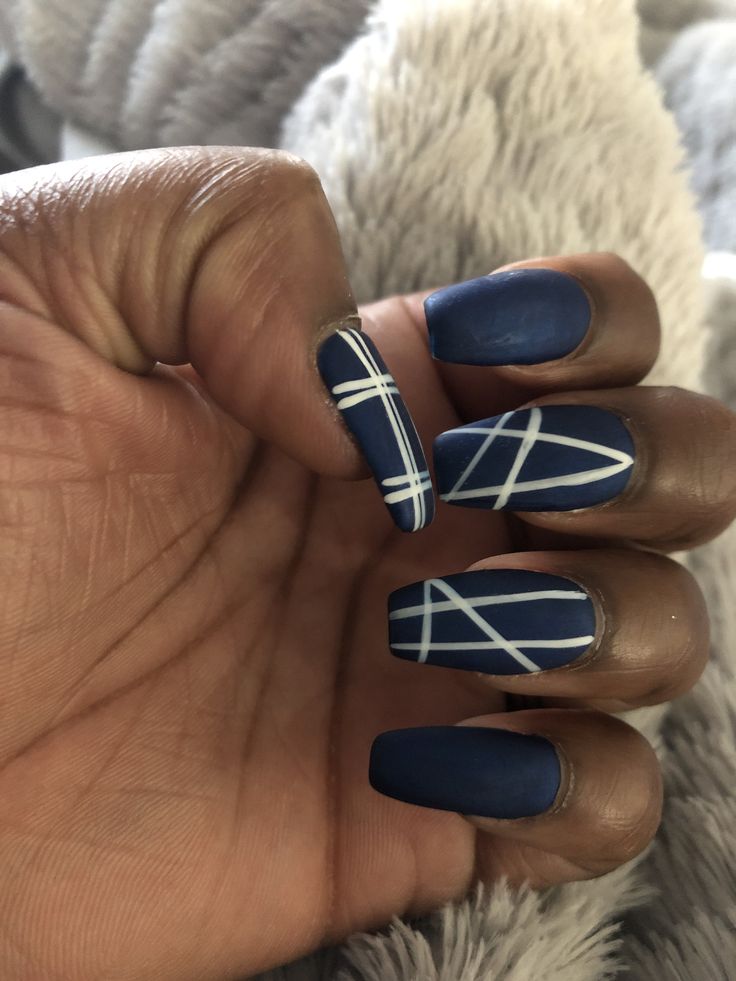 Chic Deep Navy Matte Nail Design with Bold Geometric Line Accents.