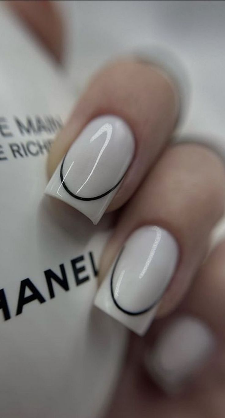 Chic Minimalist Nail Design with Elegant White Base and Sleek Black Accents