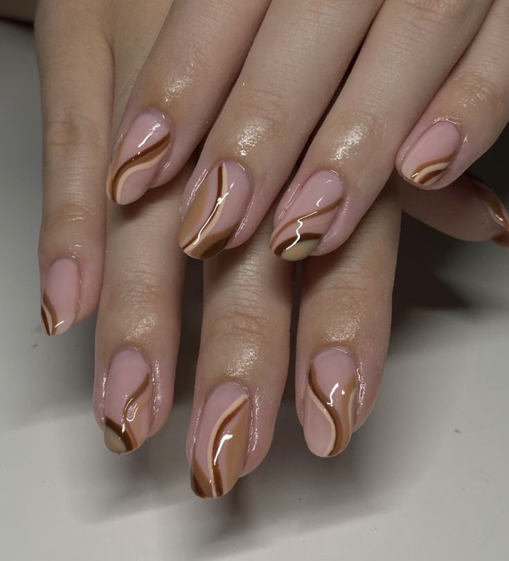 Modern Elegant Nail Design: Soft Pink and Warm Brown Swirls with Glossy Finish