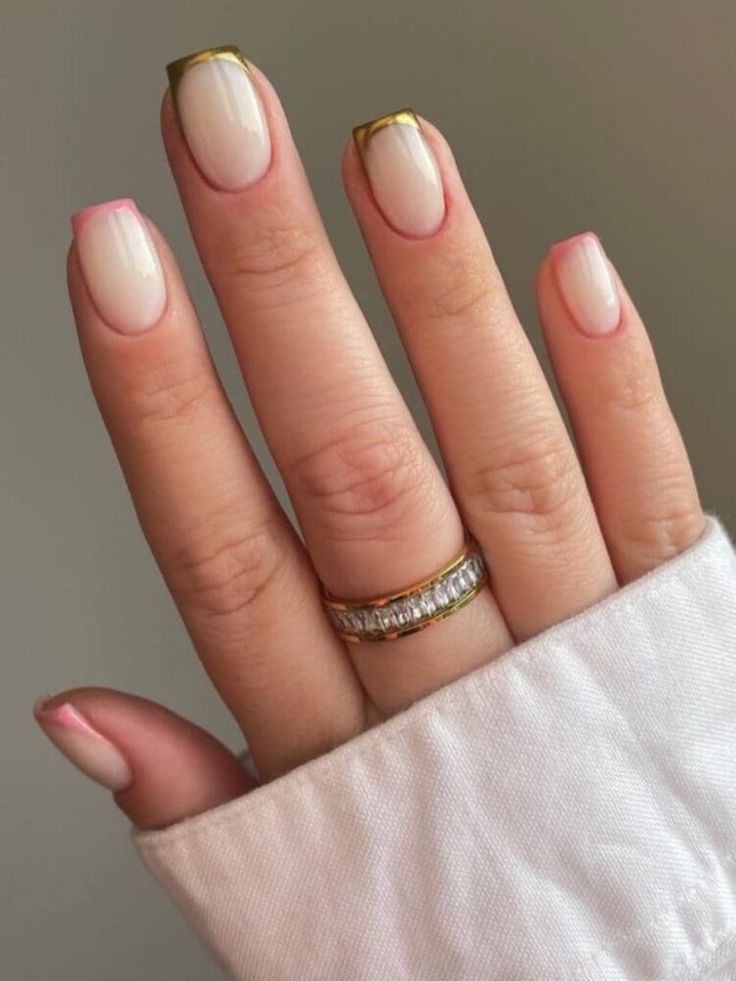 Chic Neutral-Based Nail Design with Delicate Pink Tips and Gold Accents