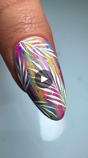 Tropical Vibrant Nail Art Design with Colorful Gradient and Intricate White Foliage