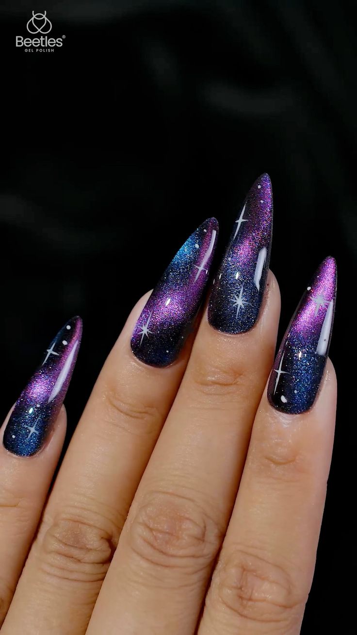 Celestial Nail Design: Deep Purples and Blues with Glittering Star Accents