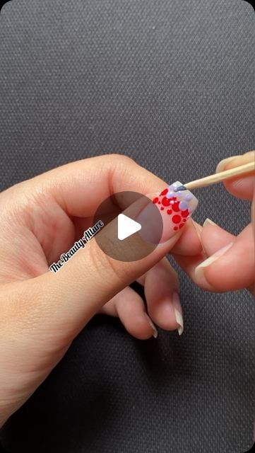 Vibrant Red and Blue Polka Dot Nail Art with Intricate Toothpick Detailing