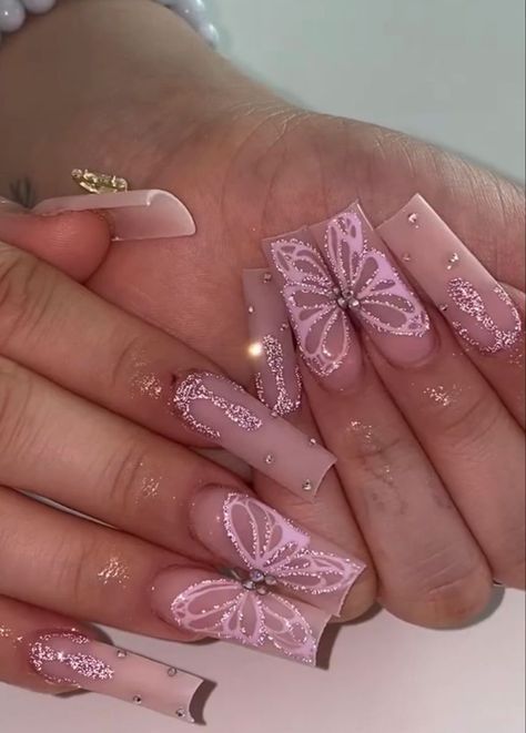 Elegant Pastel Pink Nail Design with Butterfly Motifs and Shimmering Accents