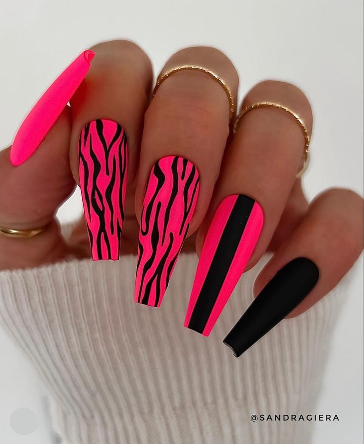 Bold Neon Pink and Black Zebra Stripe Nail Design for a Statement Look.