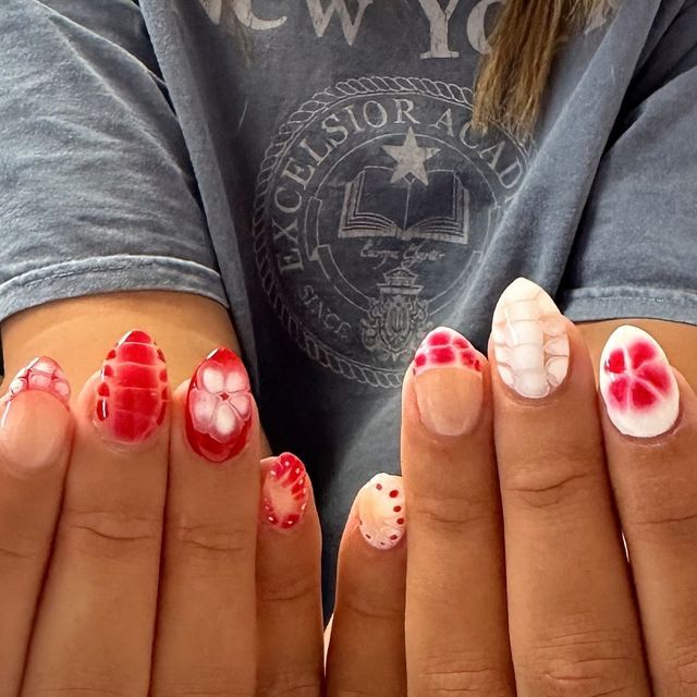 Bold and Creative Red and White Nail Design with Floral and Geometric Patterns