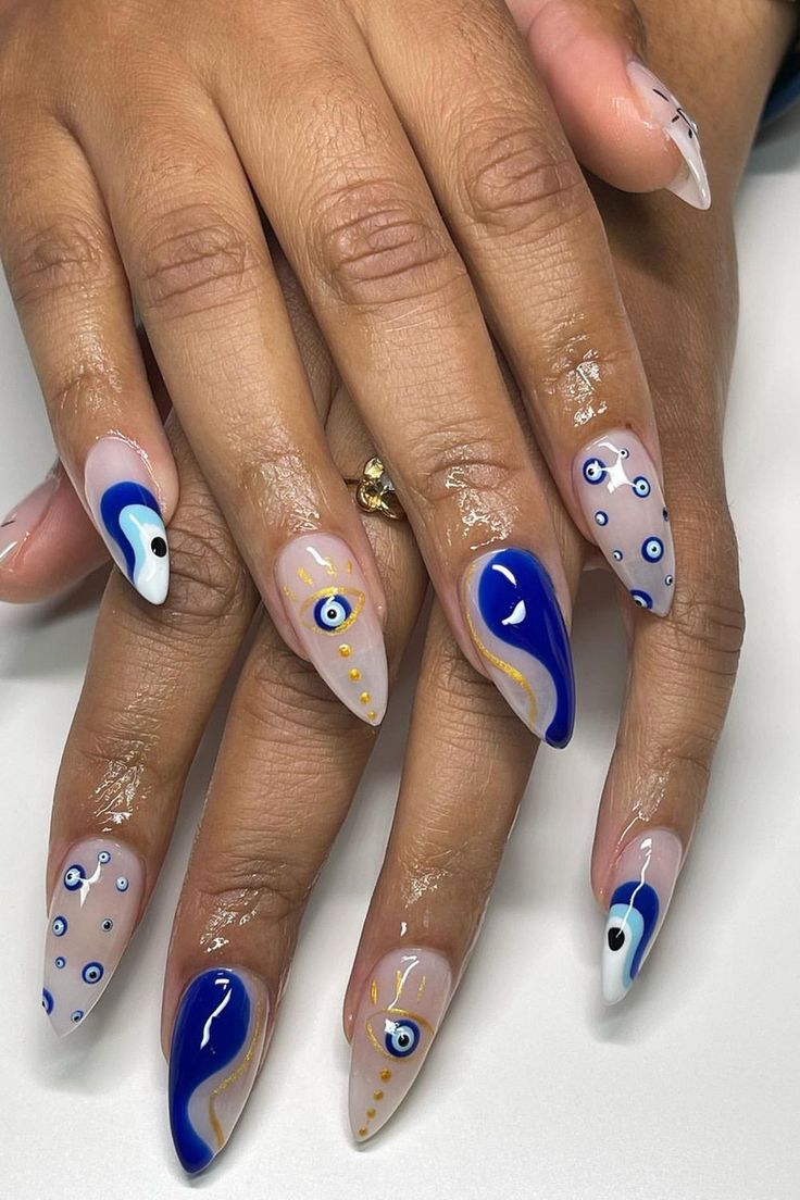 Playful Elegance: Colorful Blue and White Nail Design with Unique Patterns.