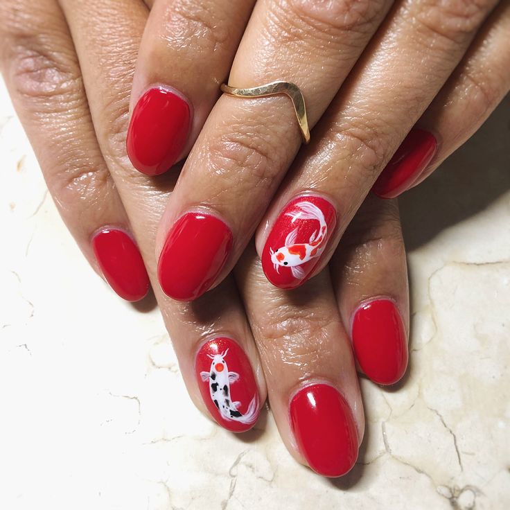 Bold Red Koi Fish Manicure: A Statement of Unique Nail Art.