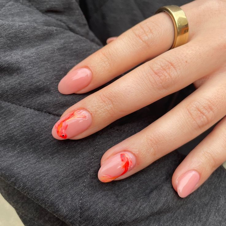 Chic Elegant Nail Design: Soft Pink Base with Vibrant Orange Swirls