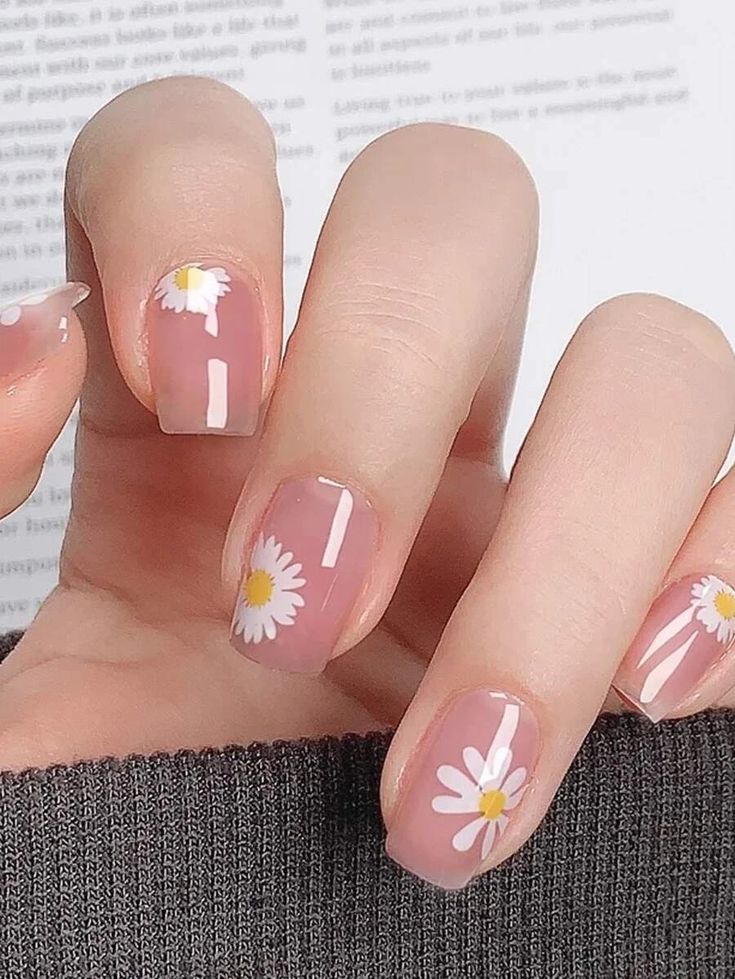 Delicate Daisy Floral Nail Design with Soft Pink Base and Glossy Finish.