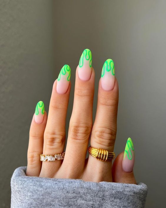 Playful Neon Green Tip Nail Design with Drippy Effect Over Nude Base.