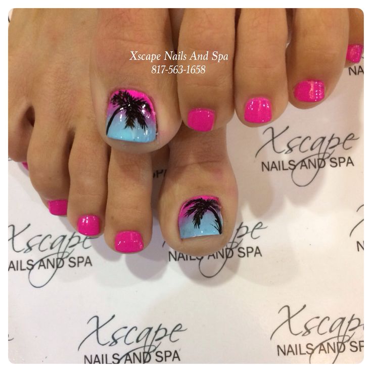 Tropical-Inspired Pedicure with Vibrant Pink and Blue Accents.