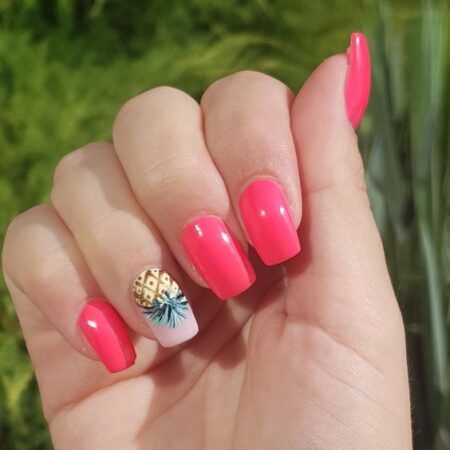 Vibrant Pink Summer Nails with Playful Pineapple Accent Design.