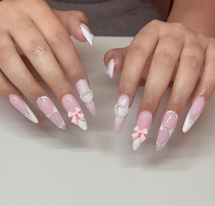 Sophisticated Soft Pink and White Nail Design with Delicate Accents.