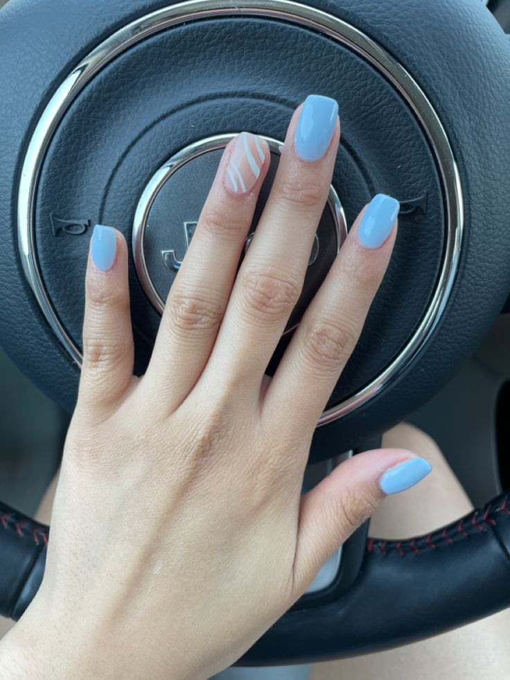 Chic Pastel Blue Nails with Elegant White Striped Accent for a Trendy Look.