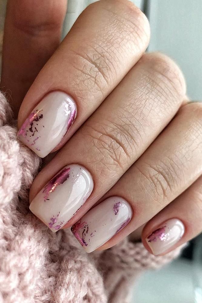 Sophisticated Nail Design: Soft Nude Base with Warm Mauve Metallic Accents and Artistic Brushstrokes.