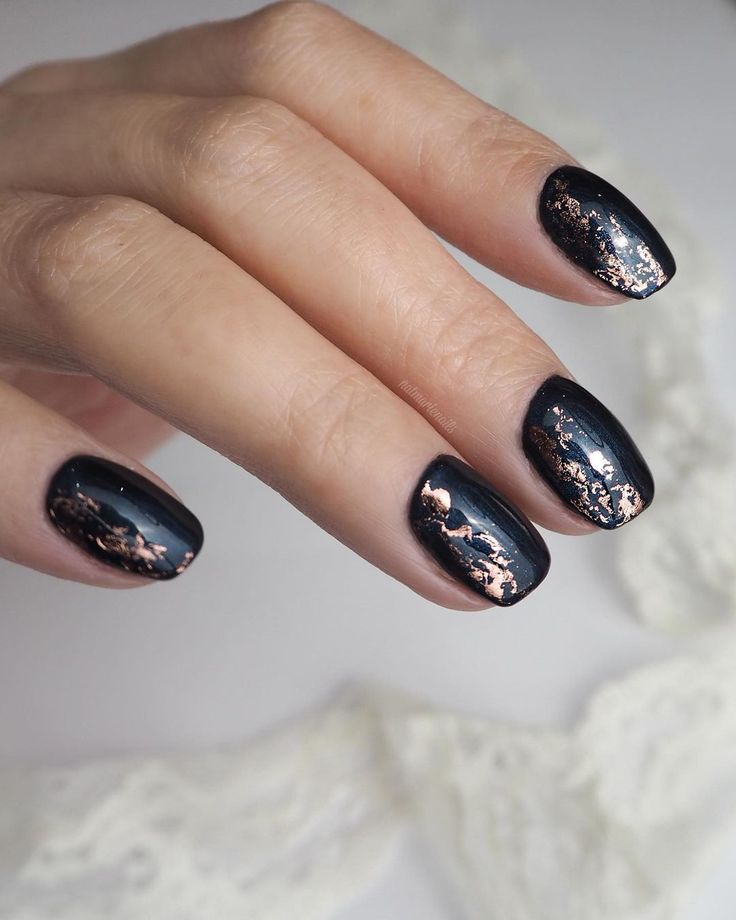 Chic Glossy Black Nails with Striking Copper Metallic Accents