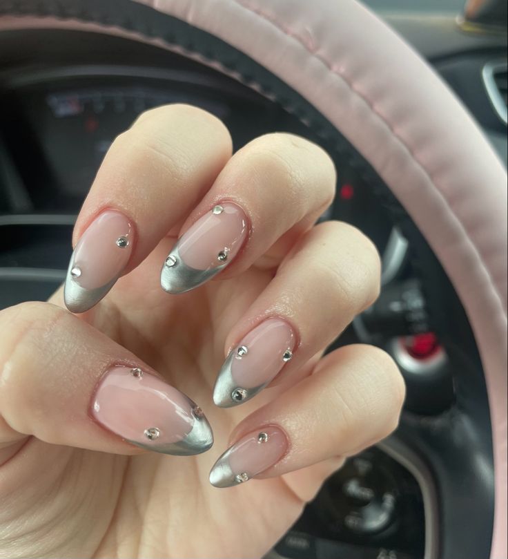 Chic Soft Pink and Metallic Silver Elegant Nail Design with Gem Embellishments.