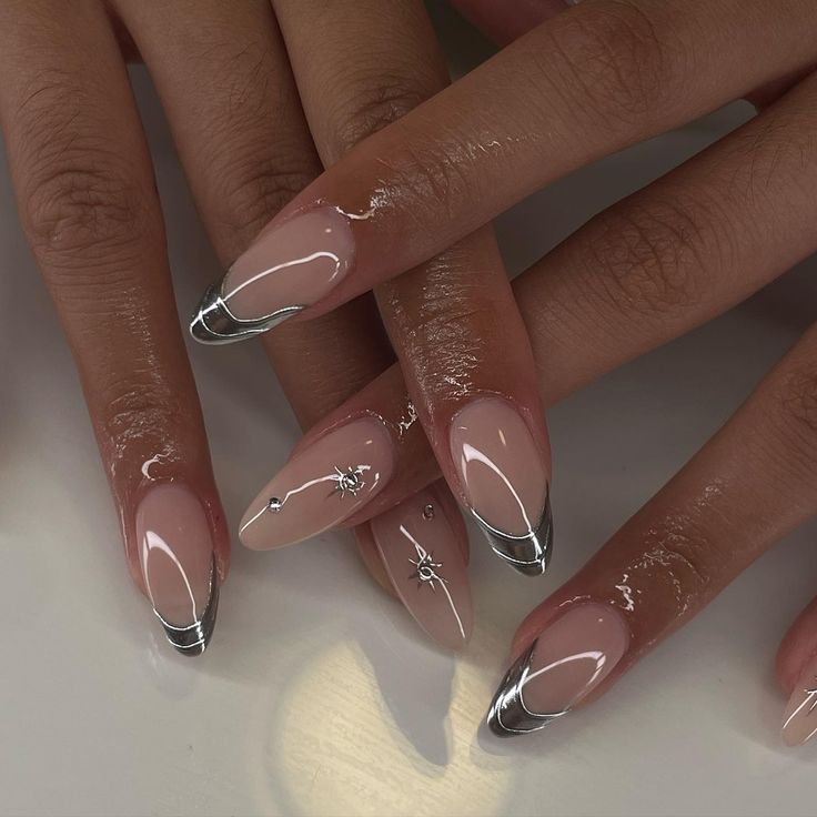 Sophisticated Almond-Shaped Nails: Soft Nude Base with Striking Silver Tips