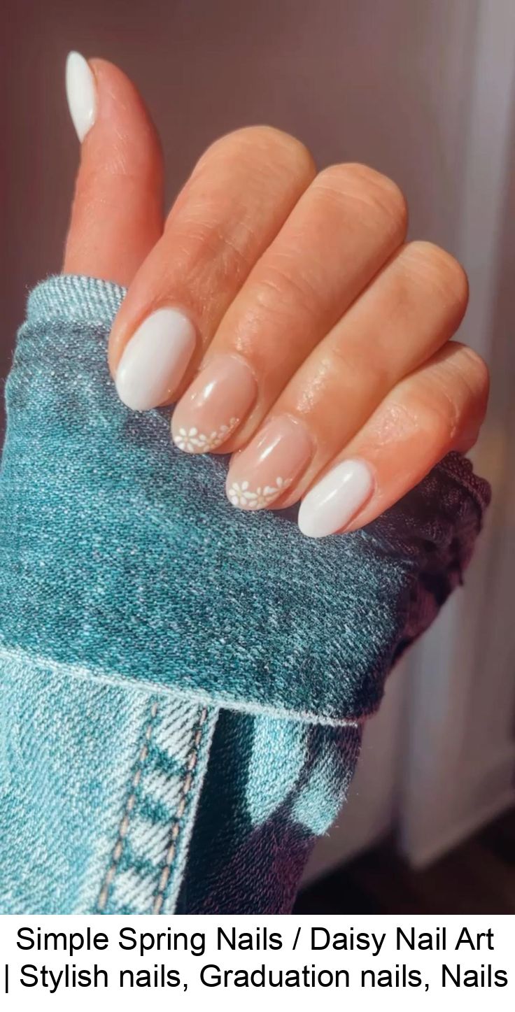 Elegant Spring Nail Design with Soft White Base and Subtle Daisy Accents