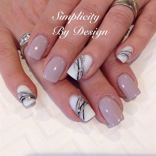 Elegant Soft Mauve Nail Design with Intricate Marble Accents and Mixed Finishes.