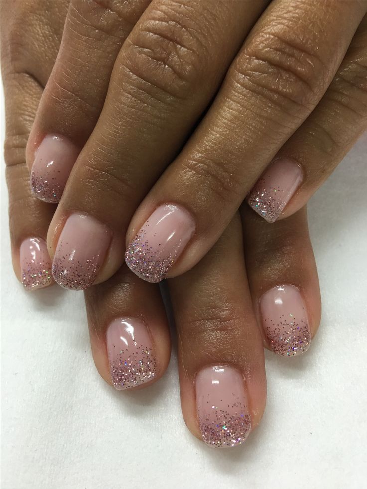 Sophisticated Soft Pink Ombre Nail Design with Glitter Tips.