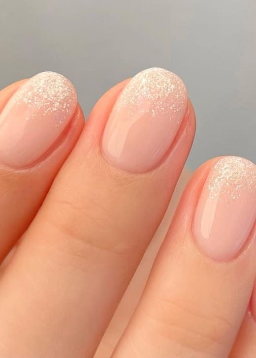 Chic Elegant Nail Design: Soft Pink Base with Sparkling Glitter Tips