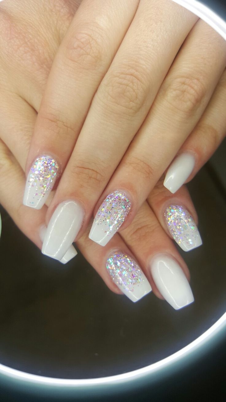 Chic Elegant Nail Design: Glossy White Tips with Sparkling Glitter Gradient.