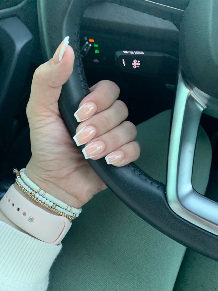 Chic Elegant Nude French Tip Manicure with Delicate Jewelry Accent