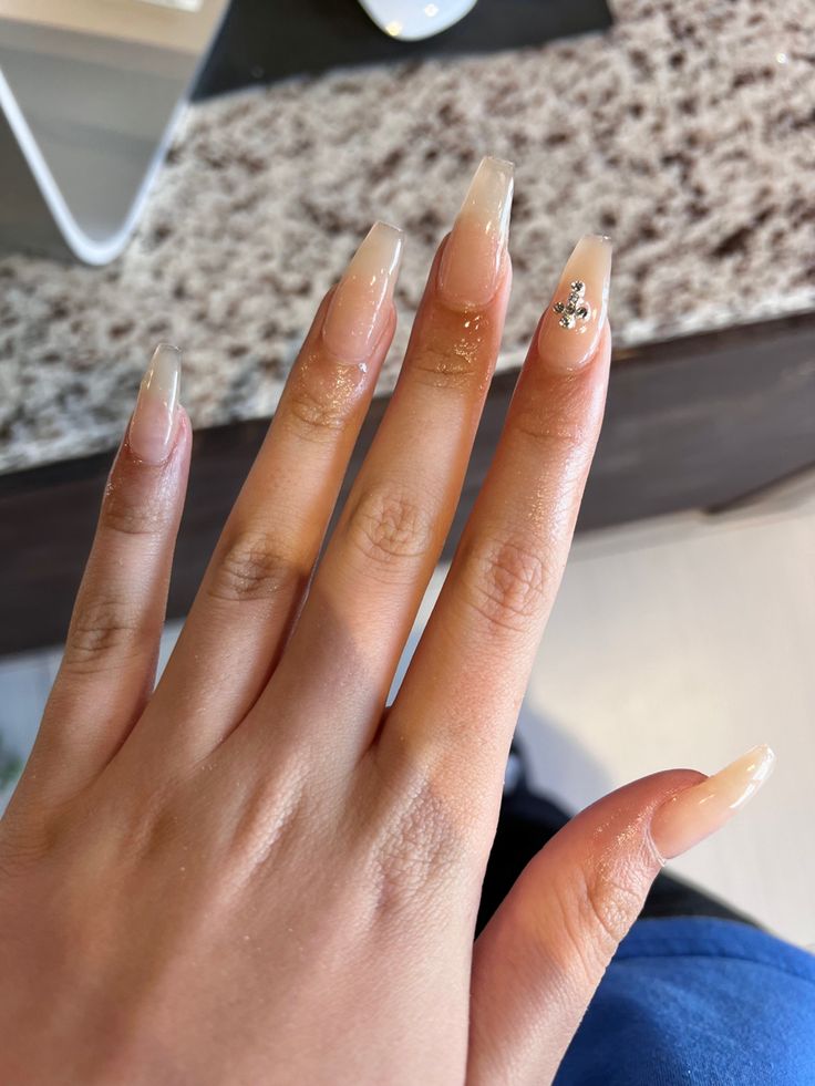 Sophisticated Ombre Acrylic Nails with Glamorous Embellishment.