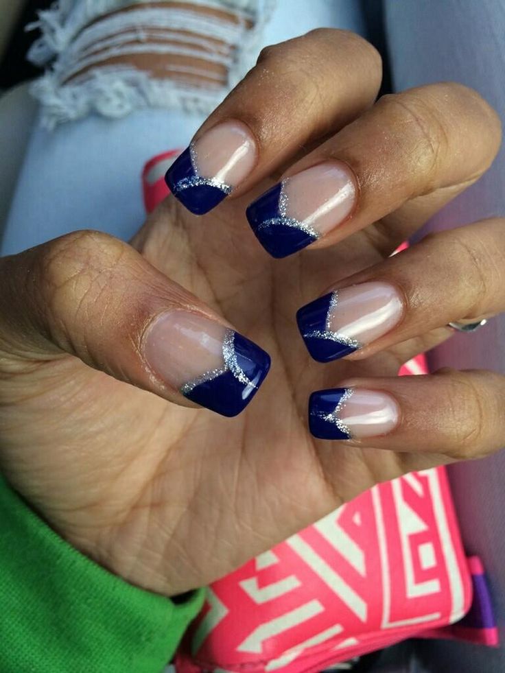 Chic Navy Blue and Clear French Tip Manicure with Silver Accents: A Modern Elegance.