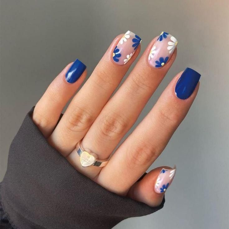 Elegant Colorful Nail Design with Deep Blue and Soft Pink Shades and Floral Accents.